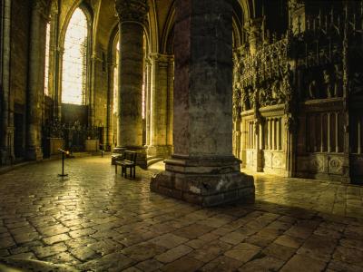 1. The image shows the interior of a Gothic cathedral featuring large clustered columns, high arched stained-glass windows, and stone flooring, with a caption identifying it as "Inside Chartres Cathedral" shot on 35mm film in 2002.