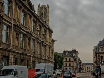 Street view toward the Musee des Beaux-Arts de Rouen, with its Gothic tower visible above the rooftops.