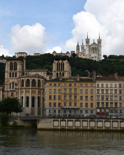 The Saône riverbank in Lyon with the Fourvière basilica on the hill above