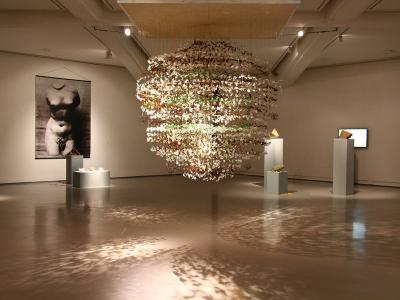 A gallery with a suspended sculpture inside MAMAC, Nice
