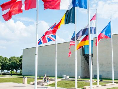 Flags outside the Mémorial de Caen museum