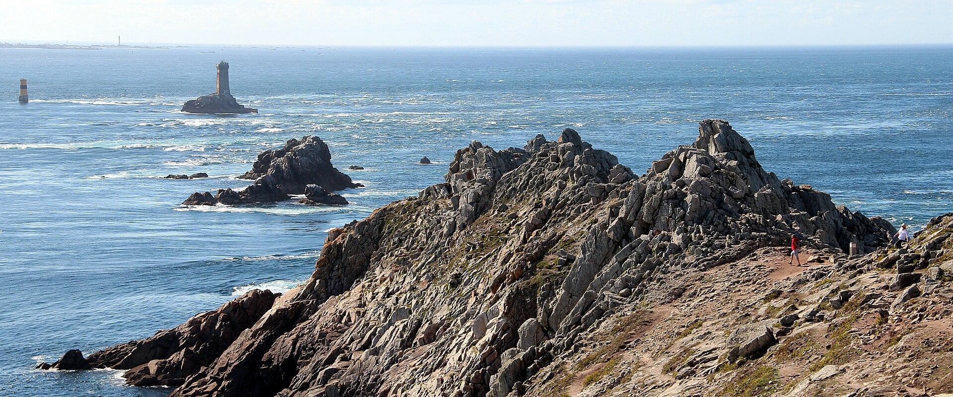 Rocky headland at the Pointe du Raz near Plogoff, with La Vieille rock in the sea