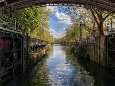 View from inside a lock looking out onto the tree-lined Canal Saint-Marin.