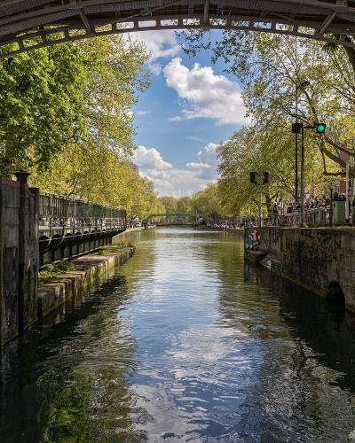 View from inside a lock looking out onto the tree-lined Canal Saint-Marin.