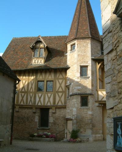 Historic stone courtyard of the Hospices de Beaune museum in France.