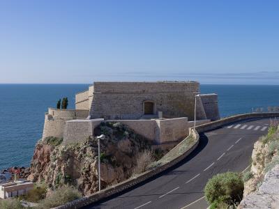 Sète's historic Fort Saint-Pierre jutting into the blue sea under a clear sky.