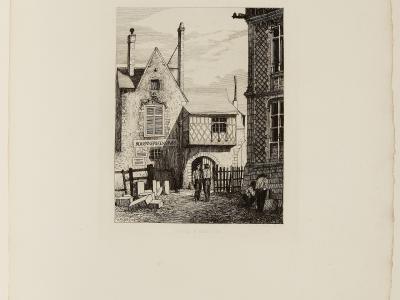 A black-and-white etching or engraving depicting a street scene with a half-timbered building labeled "ROUENNERIE GROS" and an arched gateway, with figures standing in the foreground and a larger stone building to the right; faint text below reads