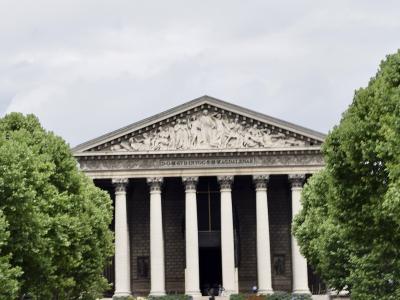 Neoclassical Greek-temple facade of La Madeleine church (Eglise Sainte-Marie-Madeleine), Paris.