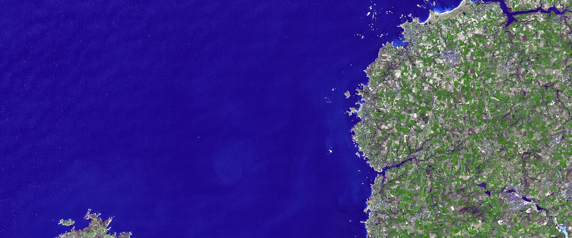 1. A satellite image showing the northwestern peninsula of France (Brittany), including the mainland coast and the island of Belle Île, with deep blue ocean surrounding it.