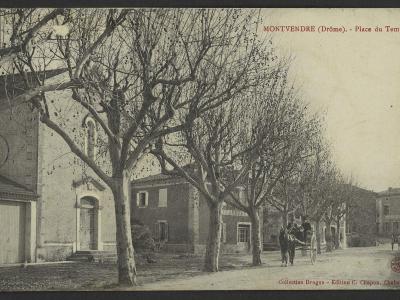 A vintage postcard showing a street scene in a French village with a large stone building on the left, a row of trees, and a horse-drawn carriage, with text reading "MONTVENDRE (Drôme). - Place du Temple".